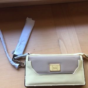 NWOT Carpisa Yellow Beige crossbody/wristlet